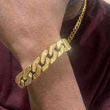 18k gold greek key bracelet on wrist